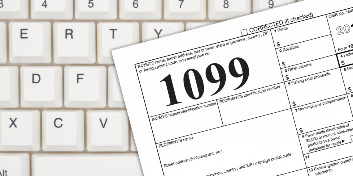 A US Federal tax 1099 income tax form on a keyboard