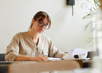 a girl reading paper