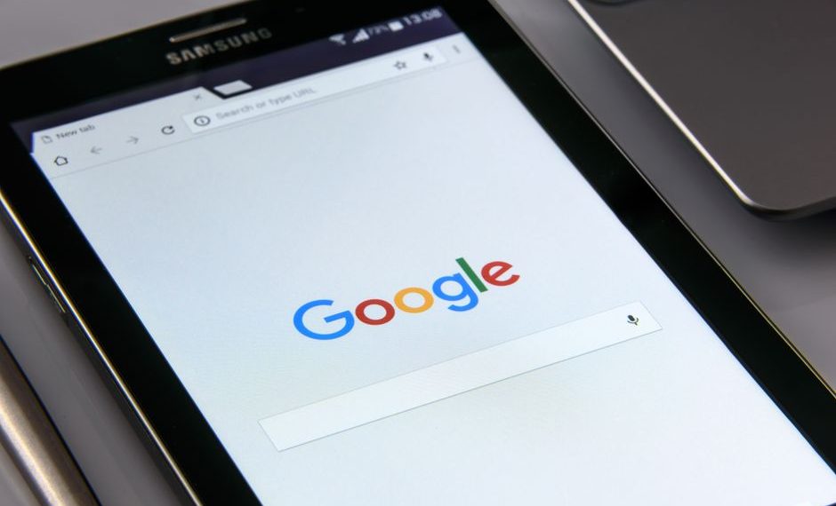 Large industrial factory overshadowed by smaller competitor appearing prominently in Google search results on laptop screen