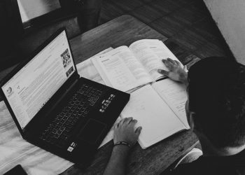 Person reading and simplifying information while studying