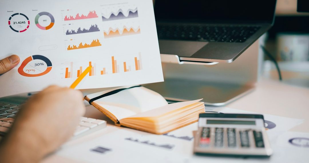 Business analyst reviewing company research and financial reports